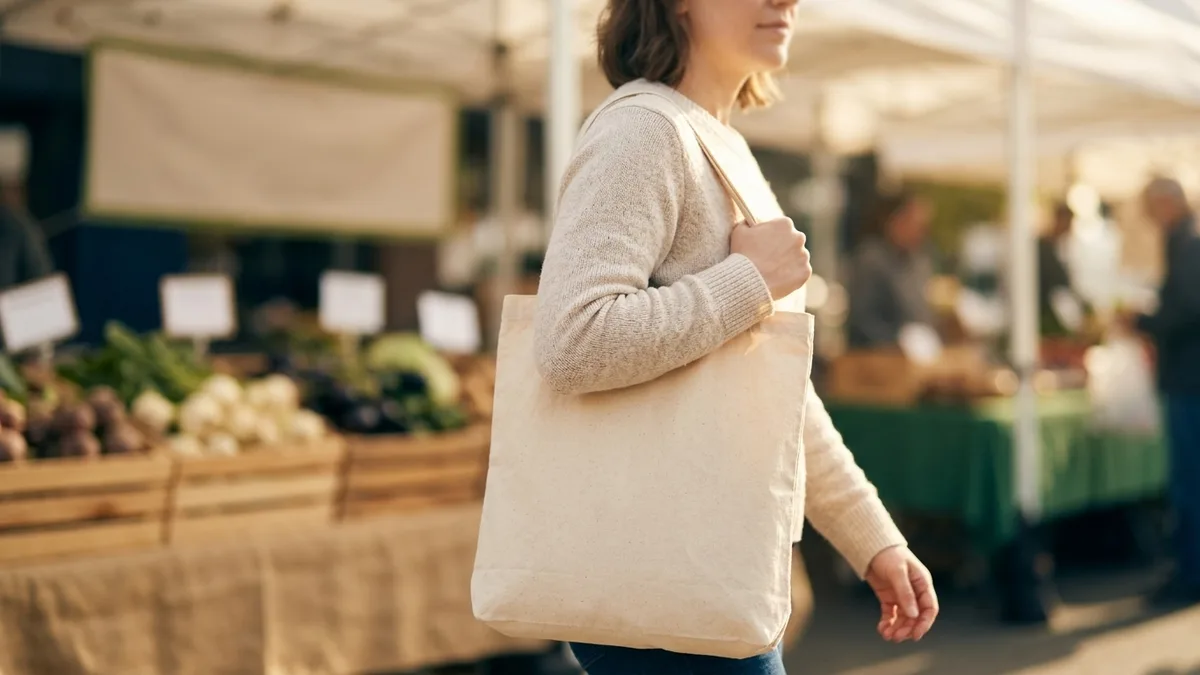 Cotton tote and heavy canvas tote side by side showing weight and structure differences
