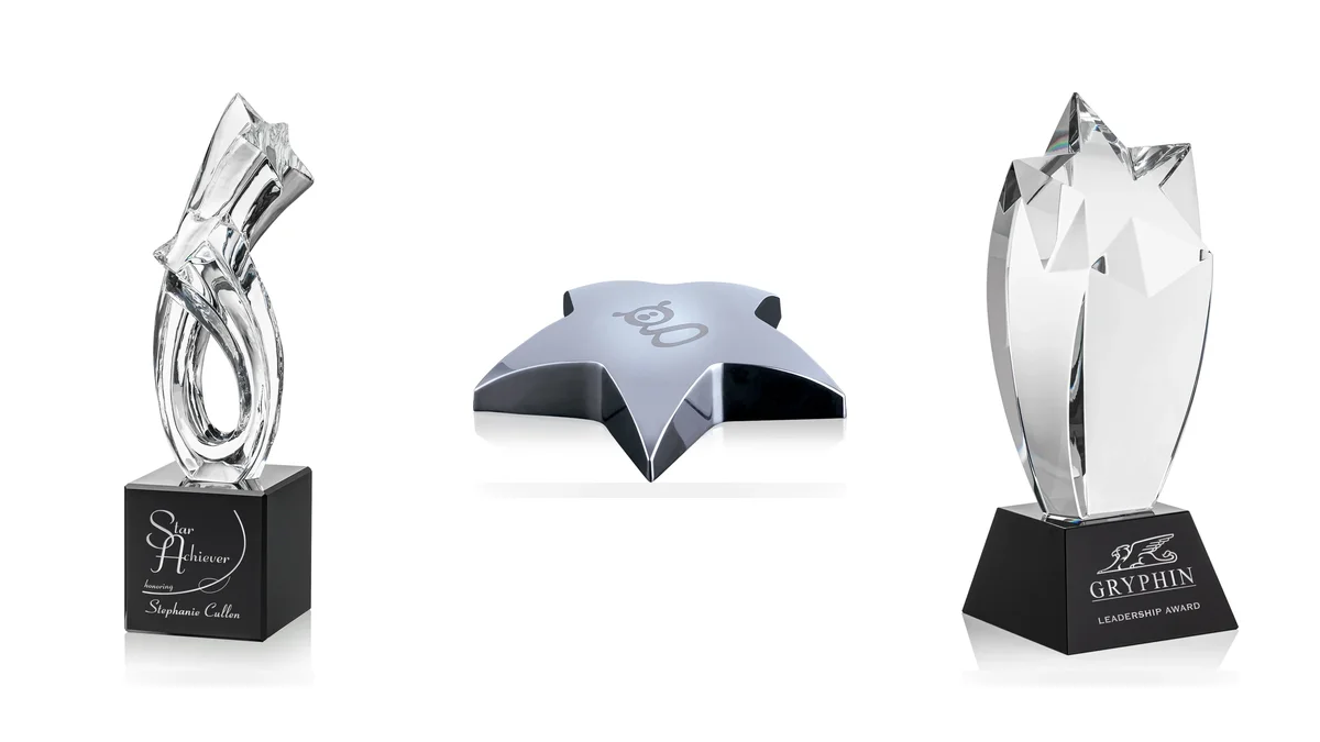 Crystal star awards and a metal star paperweight for employee recognition