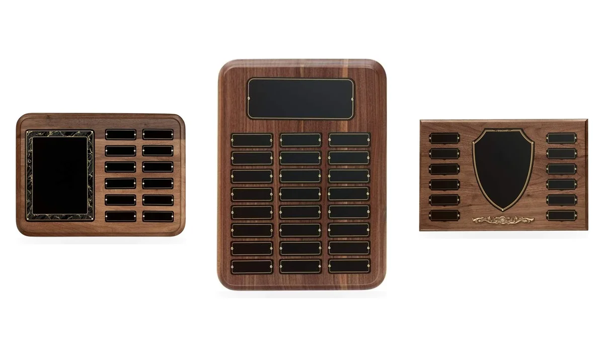 Three walnut perpetual plaques with rows of name plates for an employee of the month program