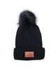 Leeman Knit Beanie With Fur Pom Pom