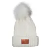 Leeman Knit Beanie With Fur Pom Pom