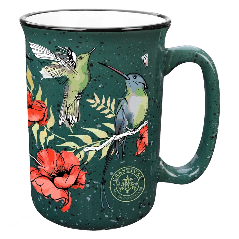 Mug cradled in one hand during an outdoor break