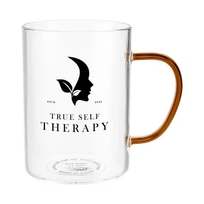 Tinted glass mug holding 13.5 ounces with a curved handle