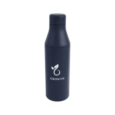 Refillable steel bottle standing upright with the lid twisted on