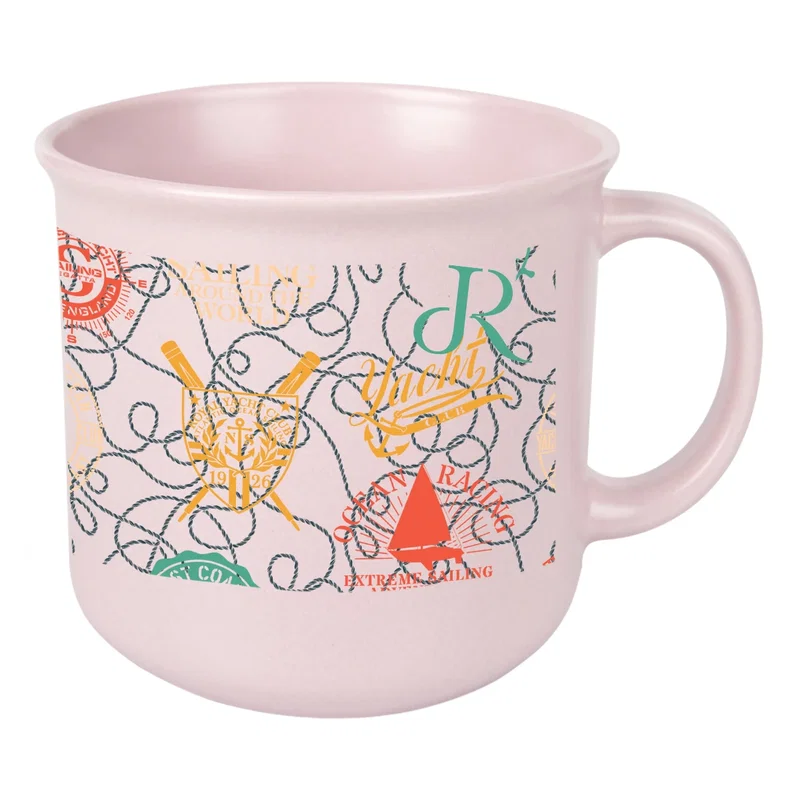 Mug set on a desk beside a laptop