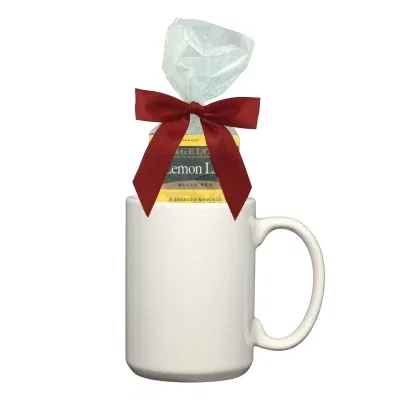 Tea sachets fanned out next to the ceramic cup