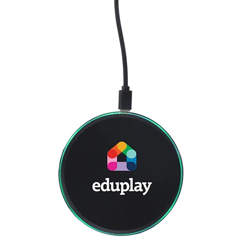 Close-up of the branded aluminum wireless charger glowing logo imprint