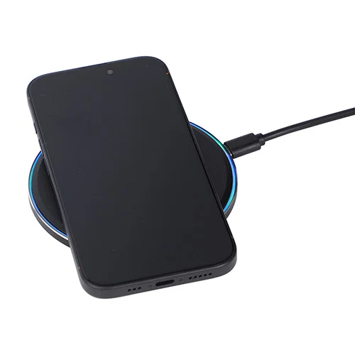 Custom 15W wireless charging pad powering a phone flat on its surface