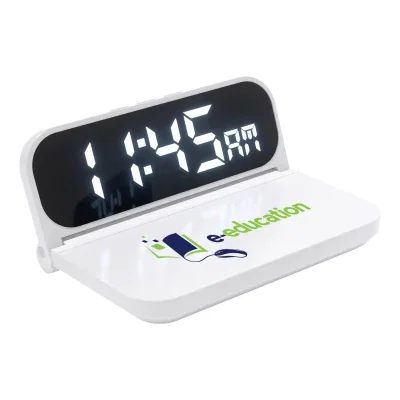 Phone charging on the pad beside the time readout