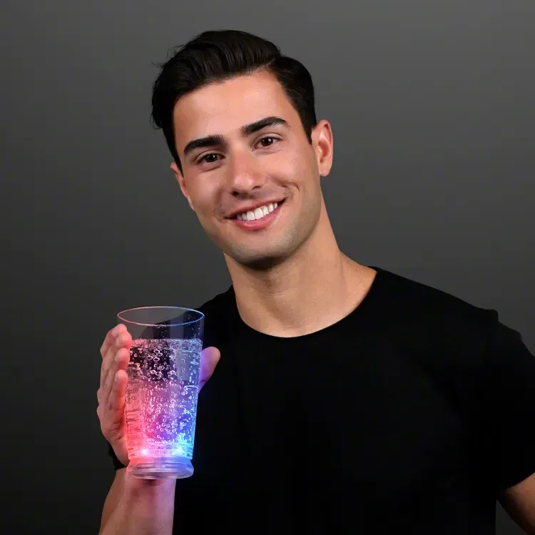 16 oz. Red White and Blue Light Up Pint Glass held in hand