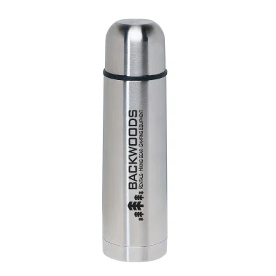 Silver stainless steel thermos standing upright on white