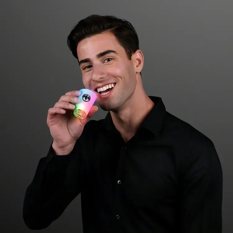 2 oz. Chill Lights LED Cool Shot Glasses held in hand
