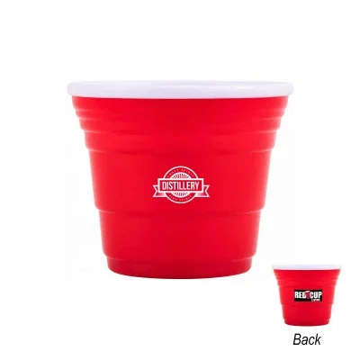 Red reusable shot cup standing two inches tall