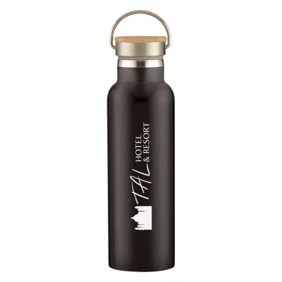 Bamboo cap shown removed from the twenty one ounce water bottle