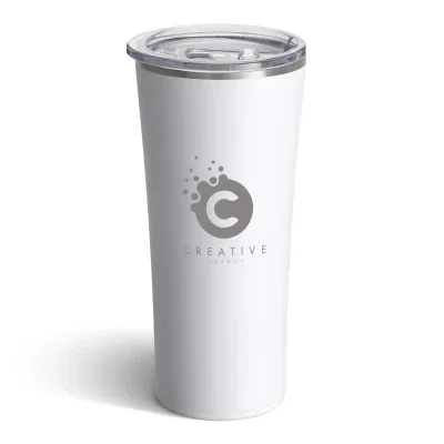 Tumbler held in one hand at a desk