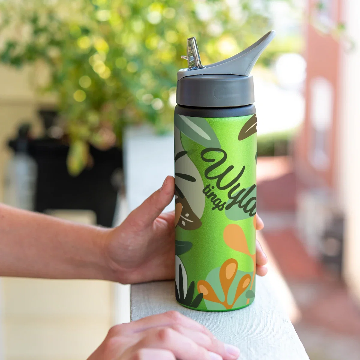 25 Oz. Full Color Aluminum Bike Bottle held in hand