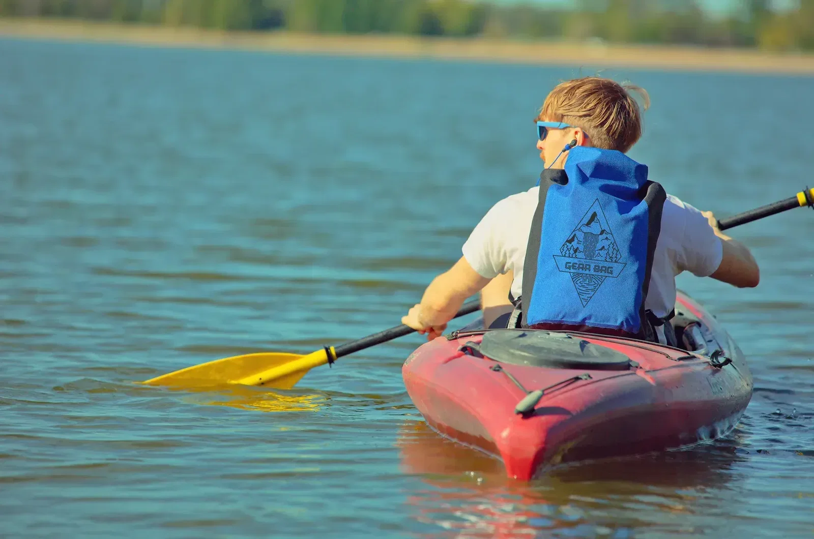 Promotional 25L waterproof backpack worn on the back, boating lifestyle shot