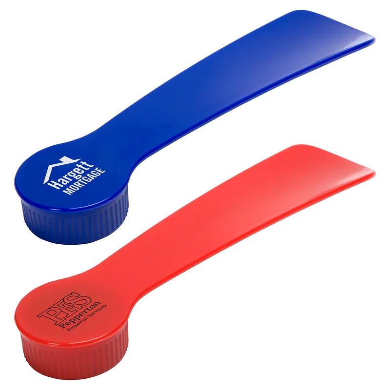 3-in-1 shoe gadget combining a shoe horn, buffing brush cap, and polish in tough PS plastic