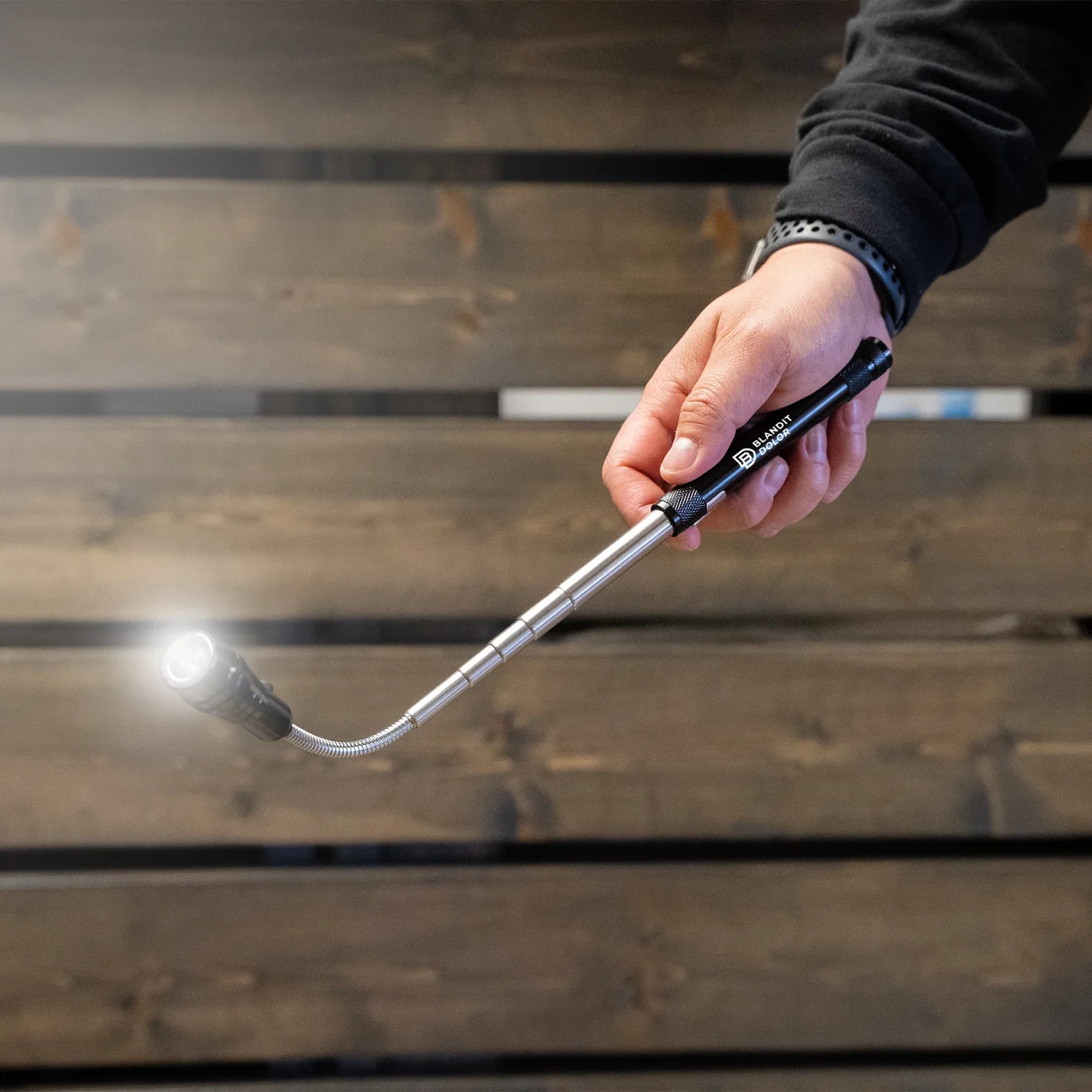 3 LED Telescopic Flashlight held in hand