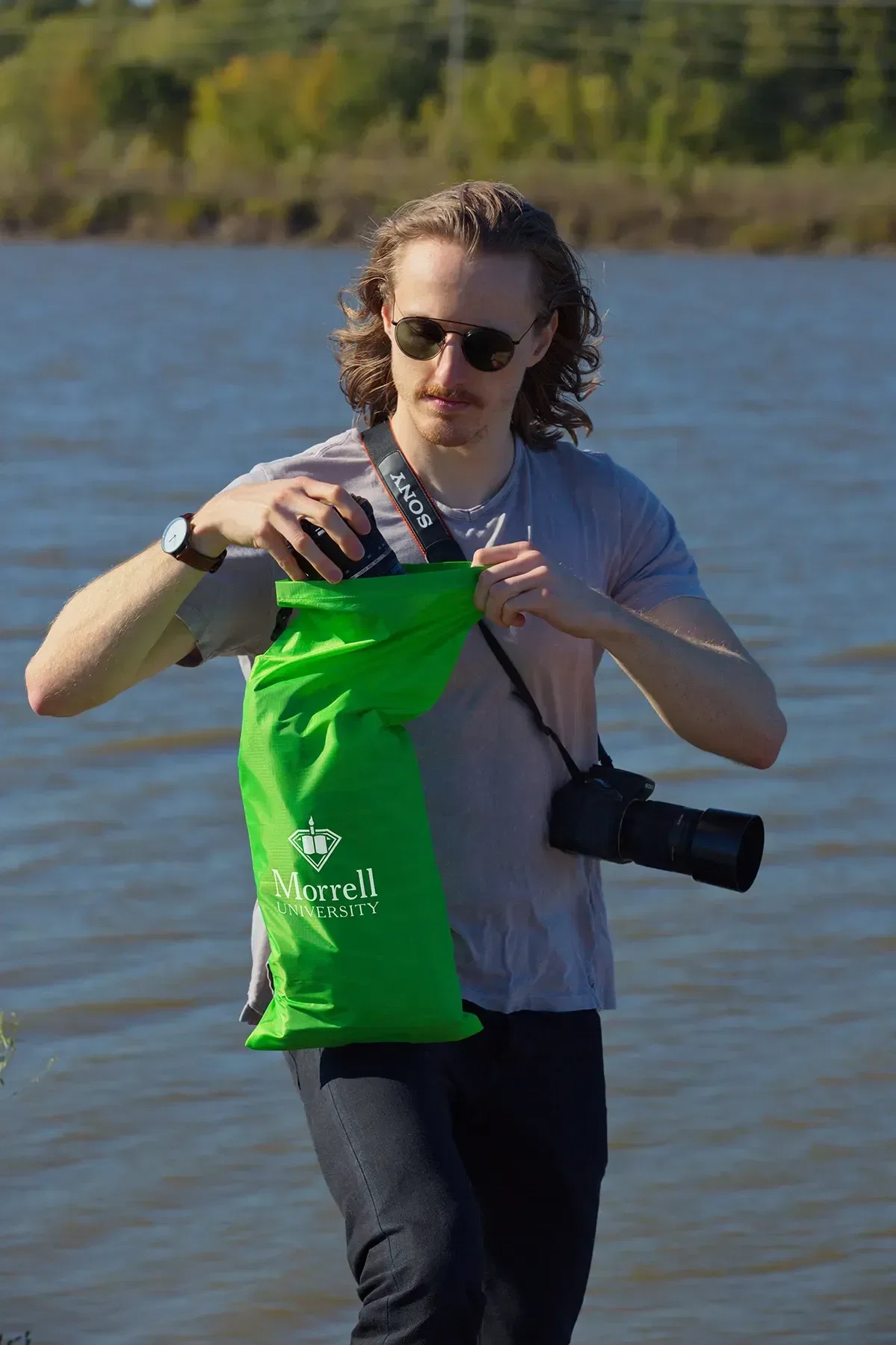 Branded 30D dry bag rolled and buckled shut, promotional camping giveaway
