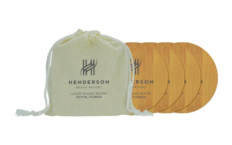 4-Piece Round Bamboo Coaster Set. Round bamboo coaster set with linen bag for housewarming gifts