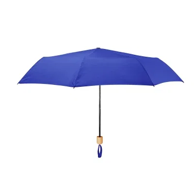 Closed and strapped, the compact umbrella fits a bag