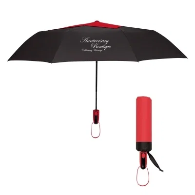 Handle end of the folded umbrella resting on a surface