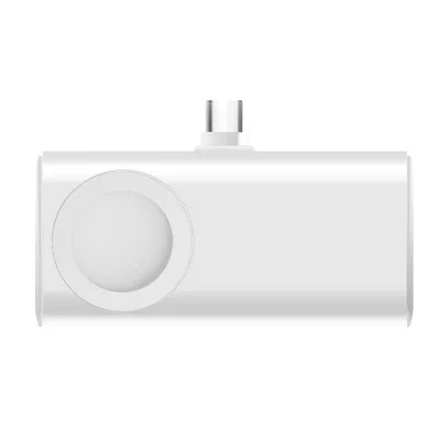 Smartwatch resting on the round charging spot