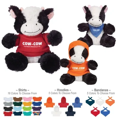 Stuffed cow in black and white, about six inches tall when seated