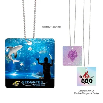 Square acrylic charm and chain measuring two inches per side
