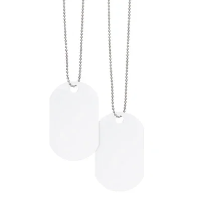 Chain resting beside the clear pendant to show its length