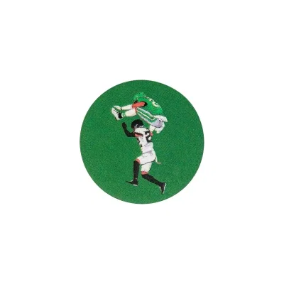 Round acrylic ball marker shown flat on the green