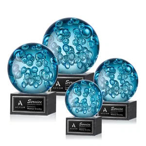 Blue Glass Sphere Award With Suspended Bubbles on a Column
