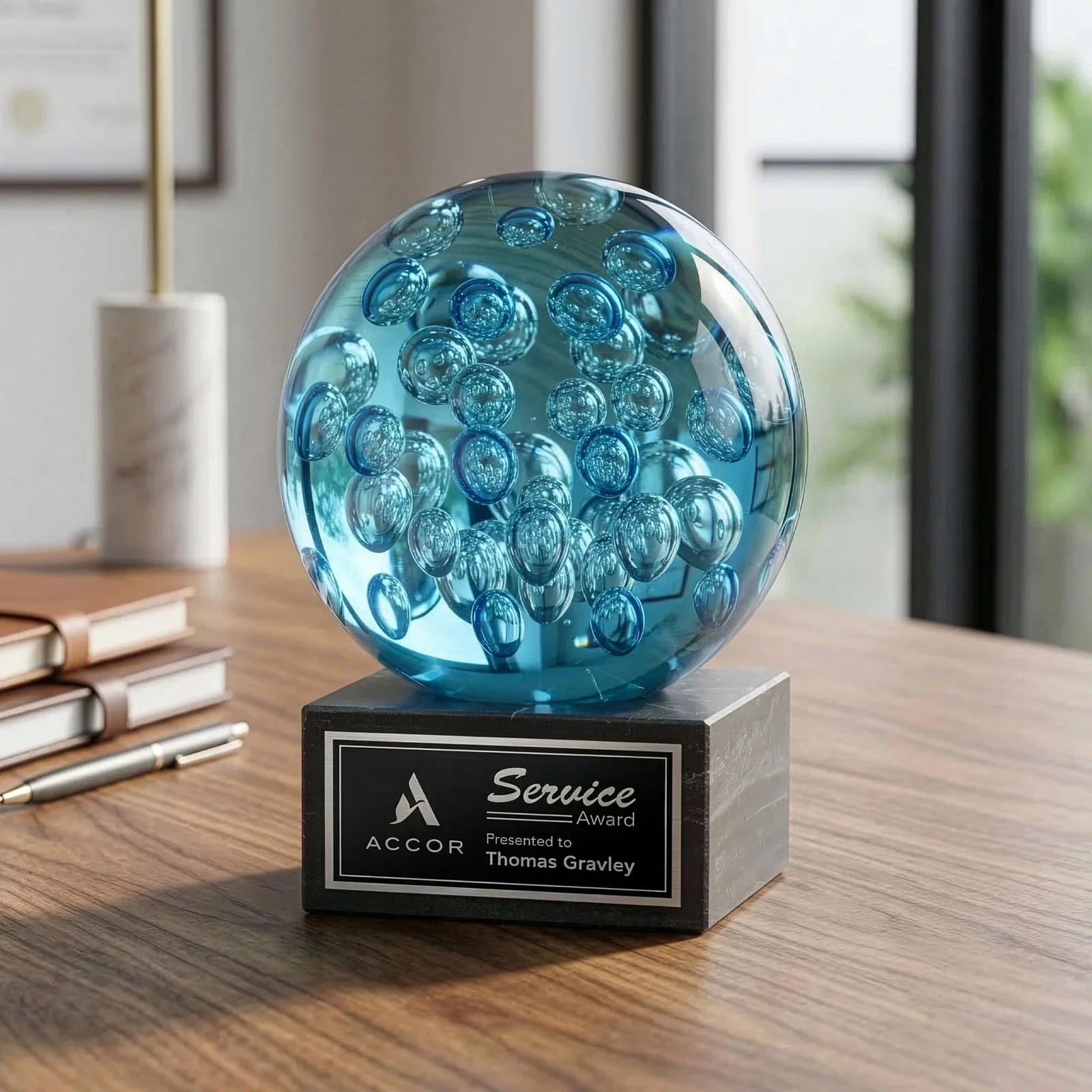 Custom Blue Glass Sphere Award With Suspended Bubbles on a Column for donor appreciation