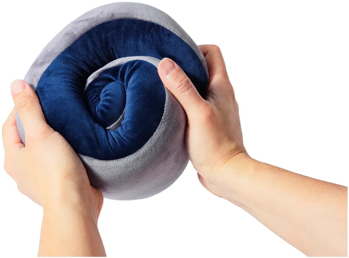 AeroLoft Memory Foam Travel Pillow Set held in hand