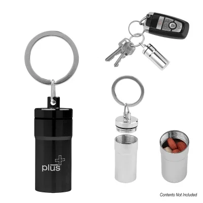 Round aluminum pill holder keychain measuring 1 1/2 inches across