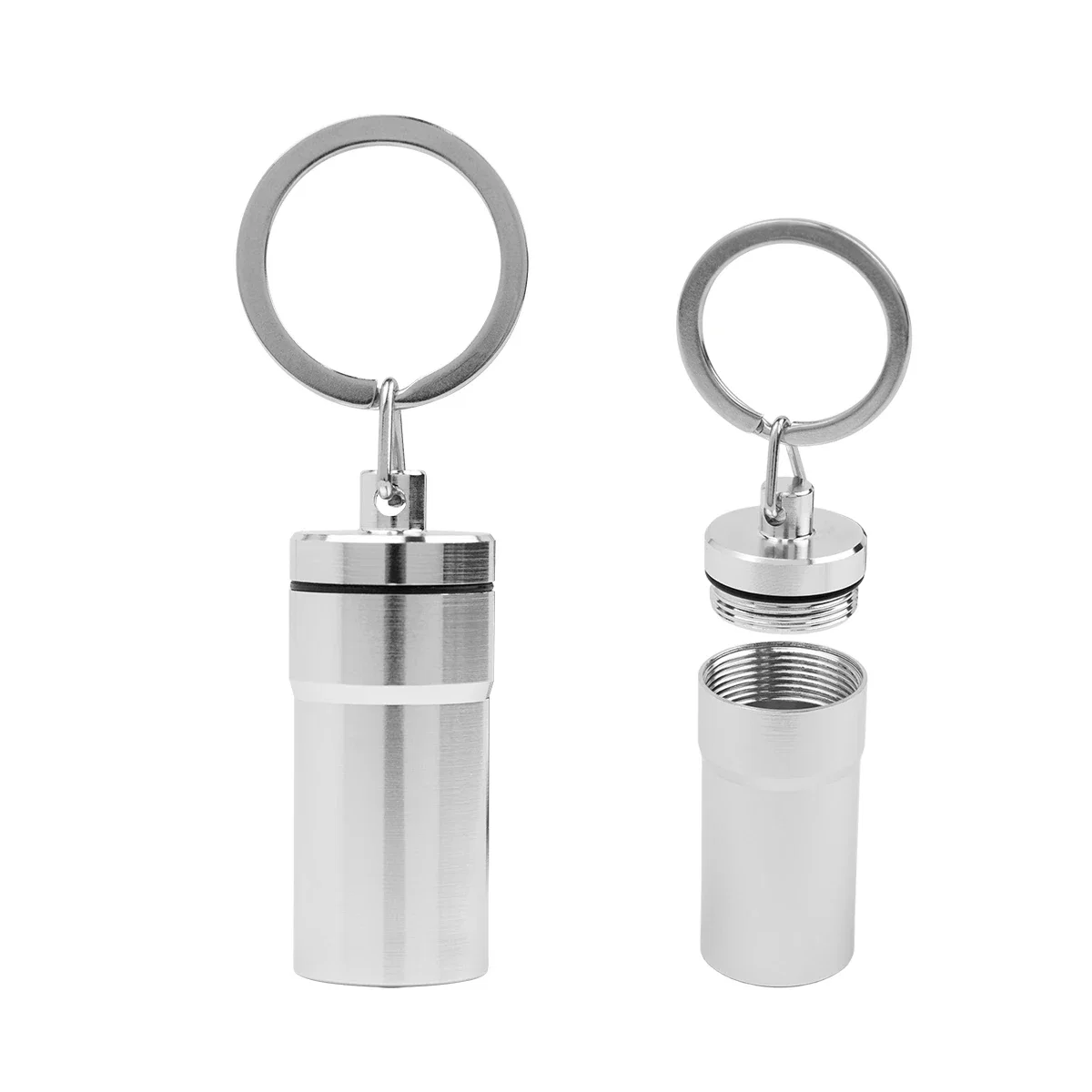 Small metal pill carrier that clips onto a set of keys