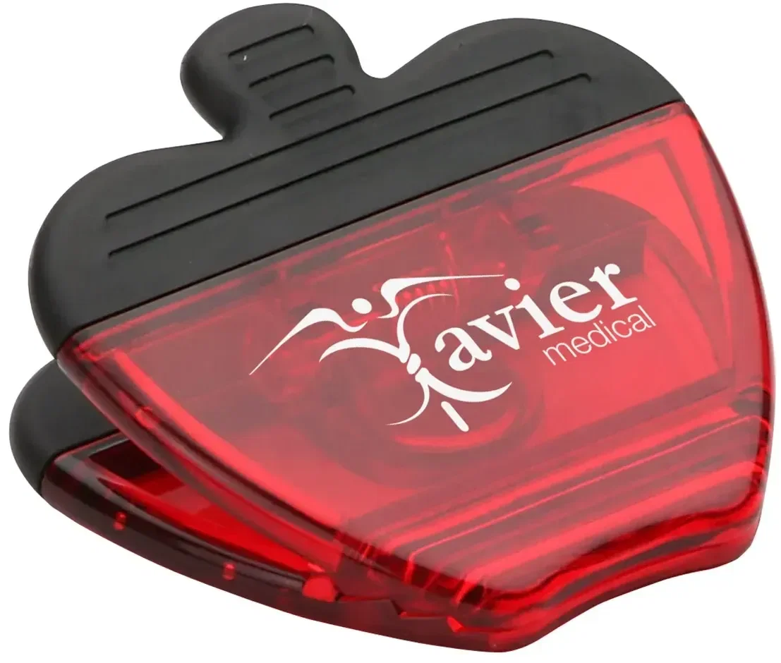 Branded apple magnetic power clip on a fridge, imprint area detail