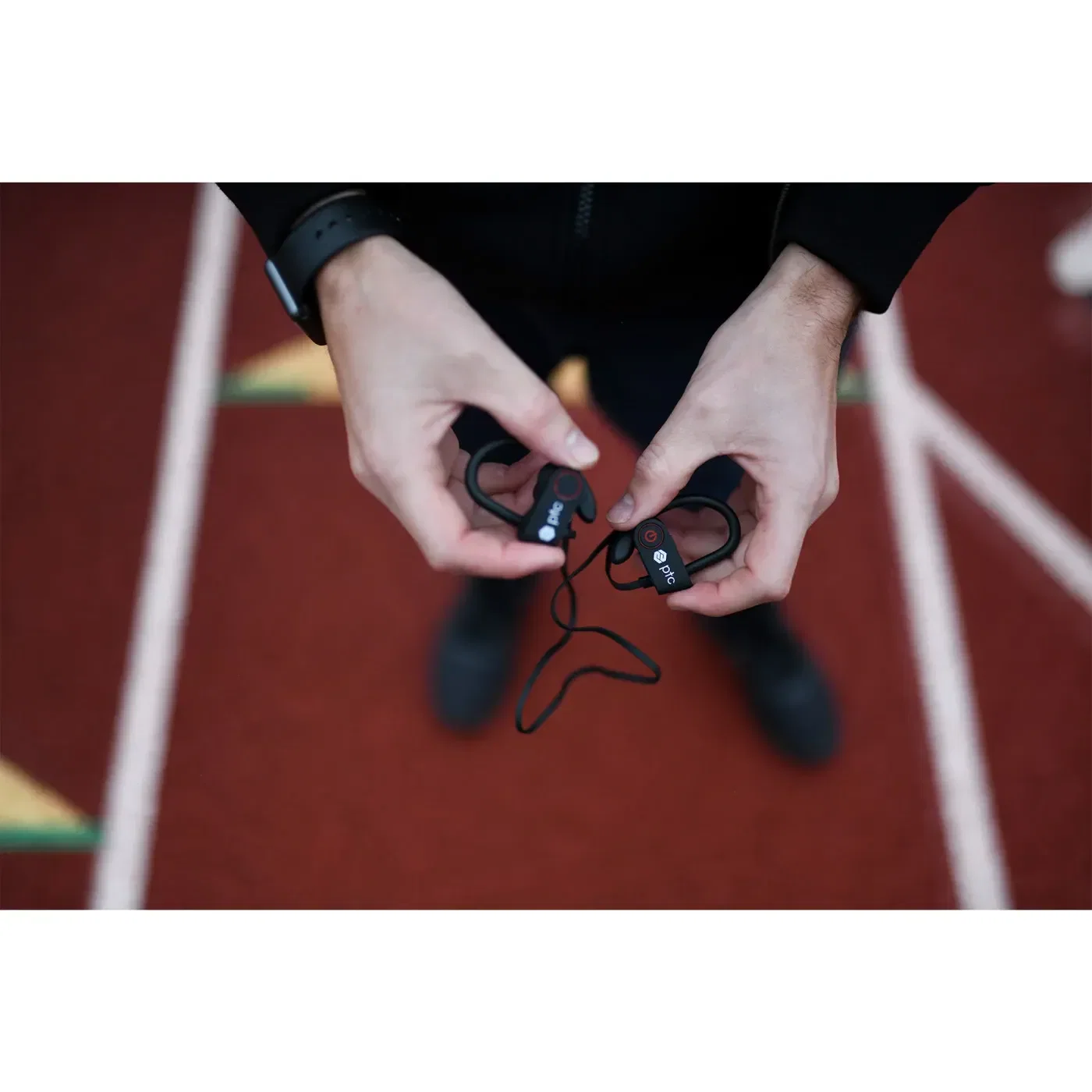 Arcos Bluetooth Earbuds held in hand