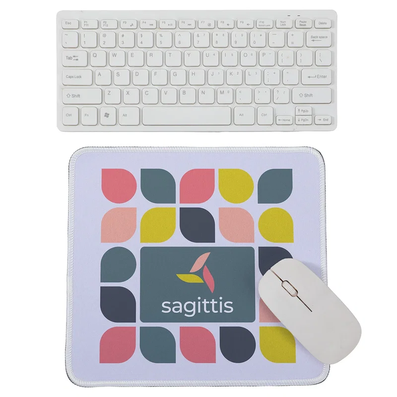 Custom Arista mouse pad on a desk with a computer mouse, lifestyle shot