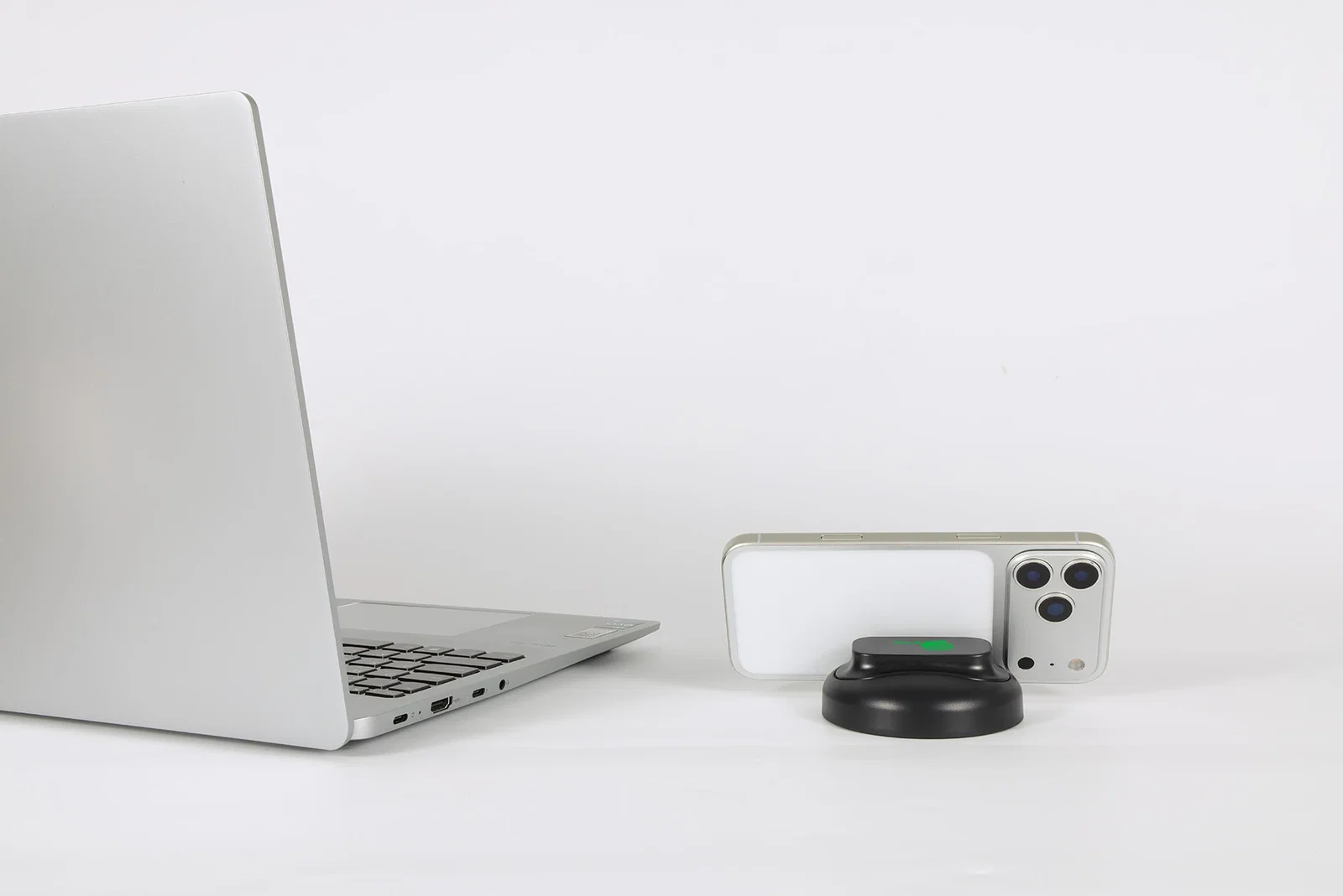 Branded Asana Phone Stand holding a smartphone on a desk, promotional stand in use