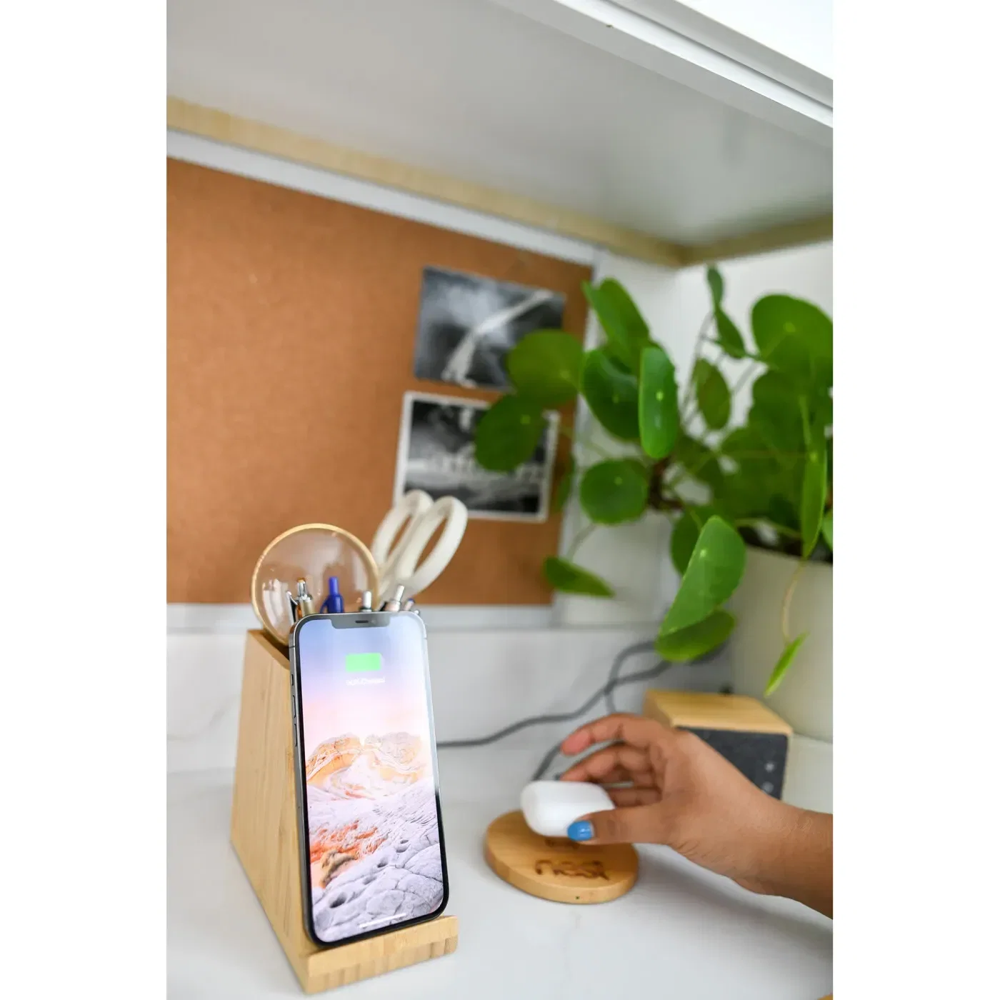 Auden Bamboo Wireless Charging Pencil Cup held in hand