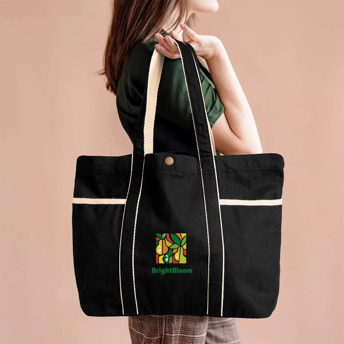 Aware™ 10 Oz. Recycled Cotton Canvas Tote Bag held in hand