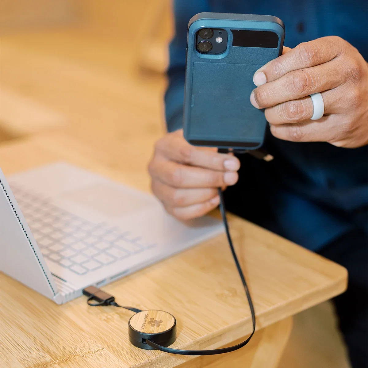 Bamboo Retractable 3-In-1 Charging Cable in use