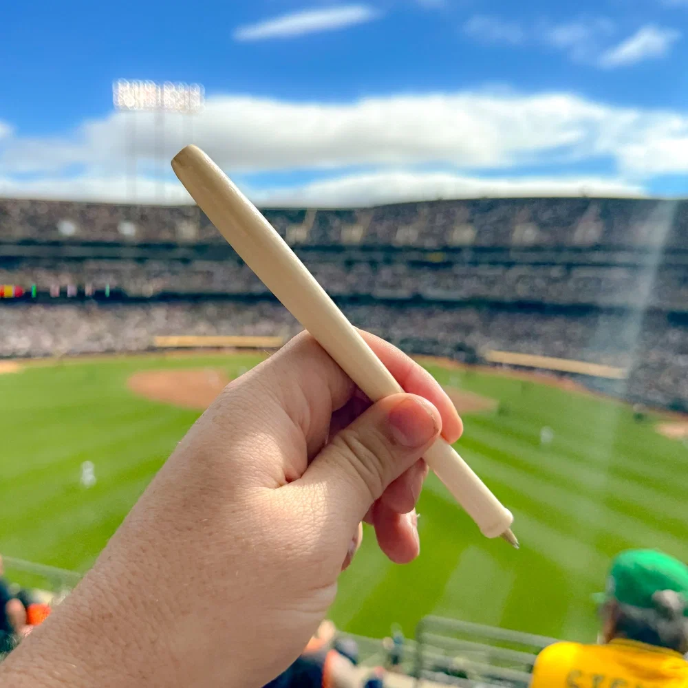 Promotional Wood Baseball Bat Pen held in hand