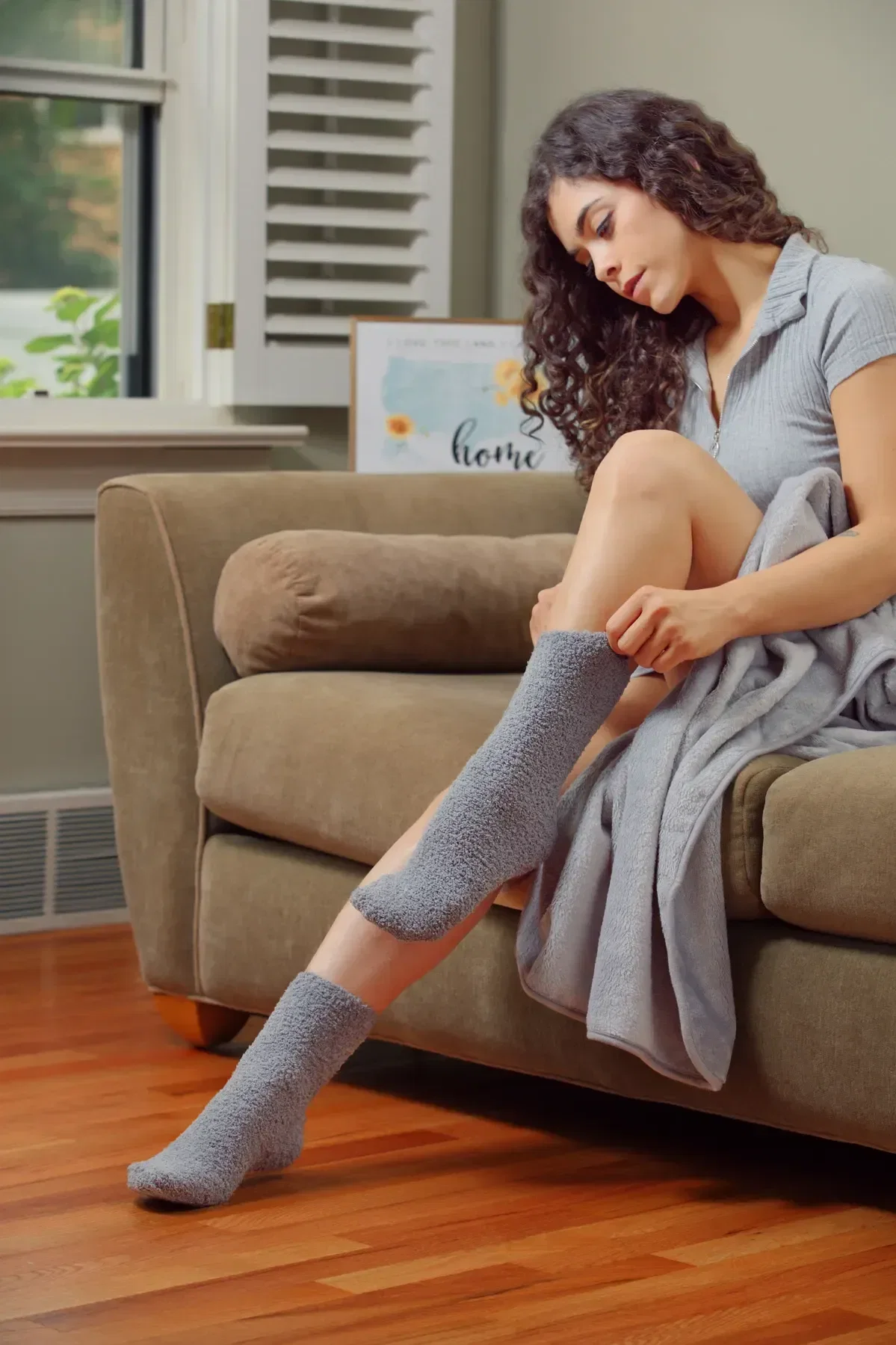 custom BeWell coral fleece socks worn, warm branded socks for wellness kits