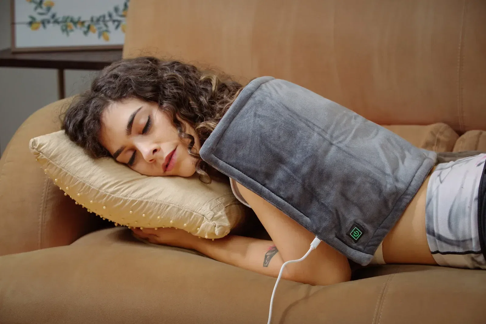 Branded BeWell heating pad, USB cord and heat controller detail