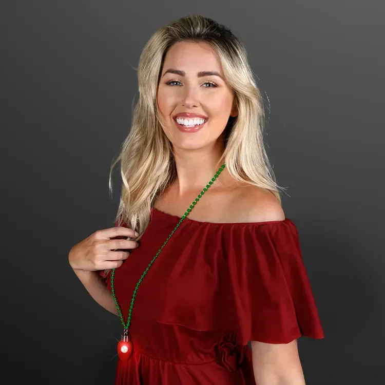 Blinking Red Bulb Christmas Charm on Green Beads being worn