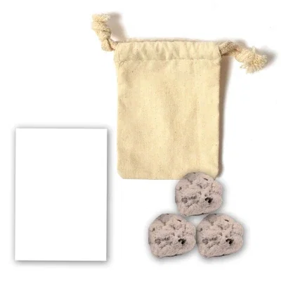 Pouch of plantable spheres beside its printed tag
