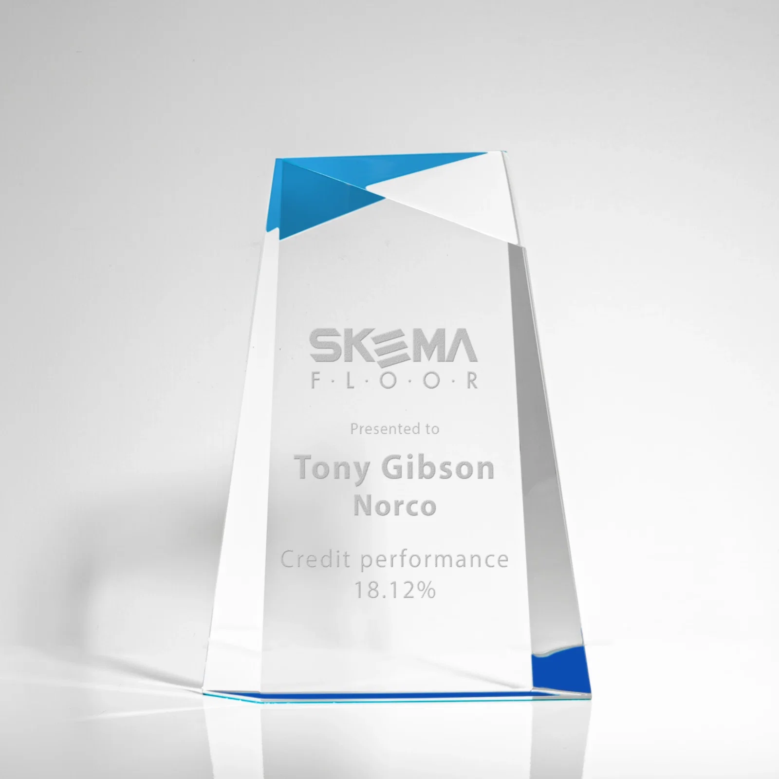 Custom Hand-Cut Facet Acrylic Tower Award on Mirrored Blue Base for corporate award ceremonies